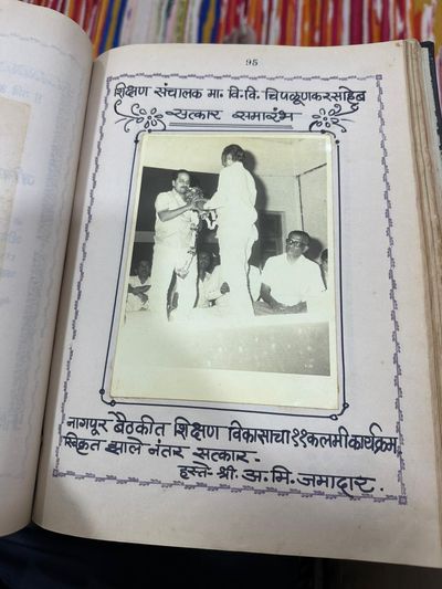 Felicitation ceremony for Education Director V. V. Chipalunkar — held after the 11-point education-development program was accepted at the Nagpur meeting; the felicitation was presented by A. M. Jamadar.