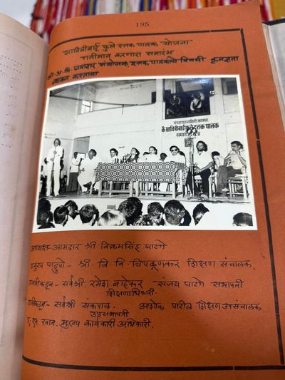 A ceremony energising the Savitribai Phule Foster-Guardian (child sponsorship) Scheme, Panchayat Samiti Kagal, 1984. A. M. Jamadar as convener/organiser announcing selected foster-guardians; presided by MLA Vikramsingh Ghatge; chief guest Education Director V. V. Chipalunkar; also Ramesh Kalekar, Sanjay Ghatge (Chairman), Sankpal, Ashok Patil (Deputy Education Director), and Chief Executive Officer A. M. Rawan.